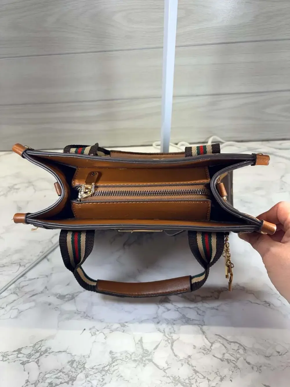 Adrienne Vittadini brown satchel handbag featuring an 